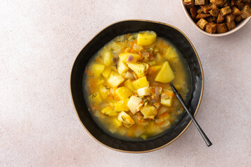 Pea soup with fried croutons, healthy bean soup, top view