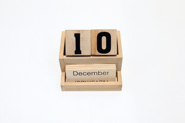 10th of December wooden perpetual calendar. Shot close up isolated on a white background 