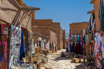 Souvenir shop with carpets, traditional clothes and other things in clay town of Ait Ben Haddou,...