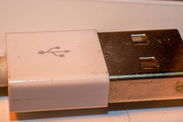 A sleek white USB cable, a modern and compact electronic accessory providing seamless connectivity...