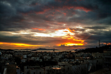 Fototapeta premium A beautiful sunset in the coastal town of Bodrum, Turkiye, paints the evening sky with vibrant hues, creating a serene and picturesque seascape