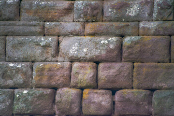 A glimpse into history with an ancient stone wall, showcasing the weathered charm and architectural resilience of this historic structure