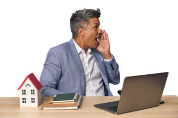 Middle-aged Hispanic businessman with real estate theme shouting and holding palm near opened mouth.