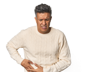 Middle-aged Latino man having a liver pain, stomach ache.
