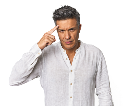 Middle-aged Latino man pointing temple with finger, thinking, focused on a task.