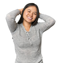 Young chinese woman isolated stretching arms, relaxed position.
