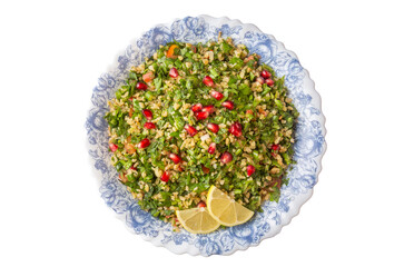 Tabbouleh salad is a traditional middle eastern or arab dish. Vegetarian salad with parsley, mint,...