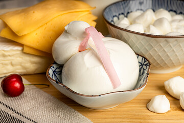 Celebrating the Jewish holiday Shavuot. Kosher fresh dairy products, milk and cheese, wooden background. Dairy products on a wooden background.