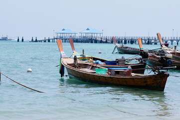Fototapeta na wymiar Traveling by Thailand. Beautiful landscape with traditional fishing longtail boats