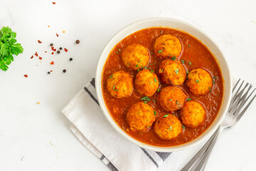 Chicken Meatballs with Spicy Sauce Made with Tomato, Garnished with Fresh Cilantro

