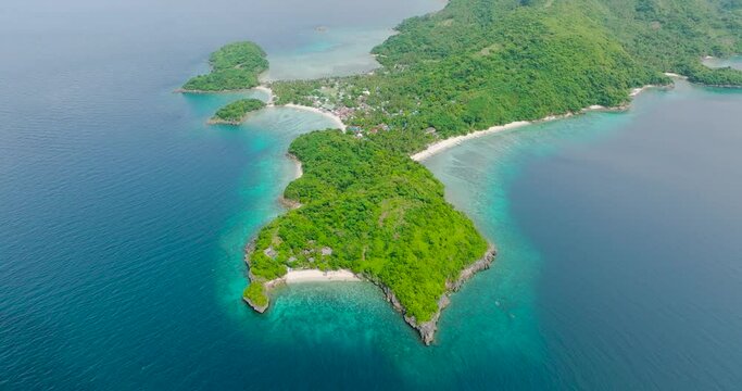 Drone view of tropical beach with white sand and corals. Alad Island. Romblon, Philippines.