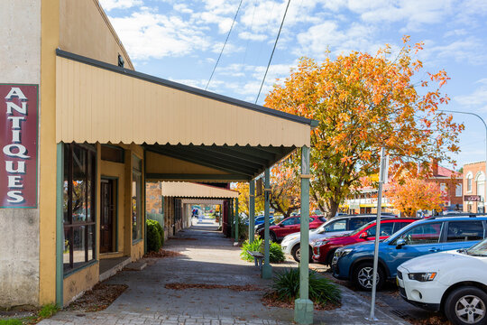 Cars in 45 degree parking spaces in front of antiques shopfront in Gunning, New South Wales