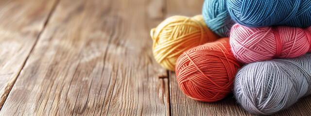 colored threads for knitting on a red background - obrazy, fototapety, plakaty