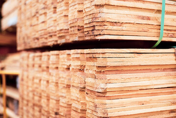 Full pallet of wooden cedar pickets with polyester strapping at hardware home improvement store in Dallas, Texas, USA, durable 1x6 pickets unfinished natural look dog ear privacy fence top