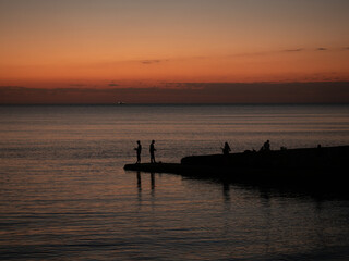 Fototapeta premium sea, evening, silhouettes, sunset, fishermen, summer