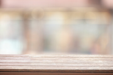 wooden table on blurred window background for displaying product mockup