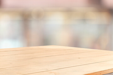 wooden table on blurred window background for displaying product mockup