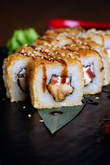 Philadelphia rolls on a black background