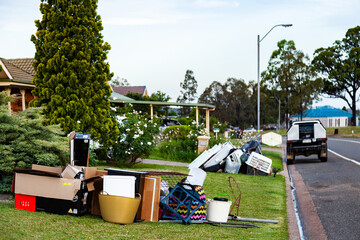 Pile of household junk on front lawn out for council bulk waste cleanup