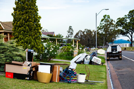 Pile of household junk on front lawn out for council bulk waste cleanup
