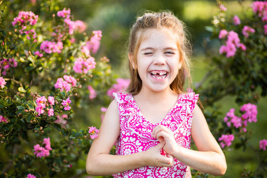 Happy Aussie girl laughing outside in garden