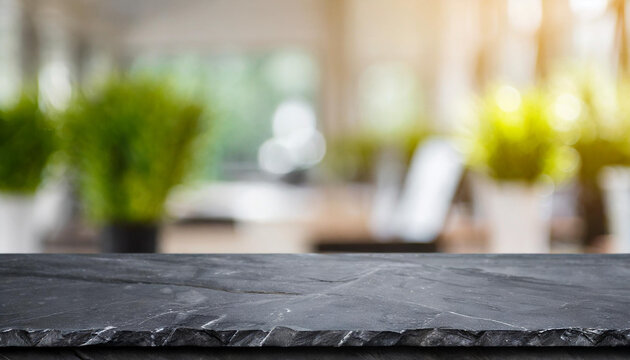 Black stone table top and blurred bokeh office interior space background - can used for display or montage your products.