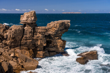 Rock formations in the site of geological interest of the cliffs of the Peniche peninsula, portugal, in a sunny day.