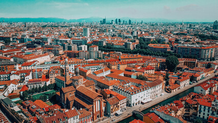 Fototapeta na wymiar Milan city skyline aerial view. The theatrical performance shot from the Milan cityscape. Aerial footage. Milan drone footage