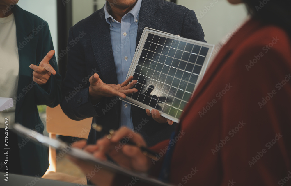 Poster Close-up at tablet, Engineers pointing at tablet with their hands. To jointly design the use of renewable energy with wind and solar energy. Concept of using renewable energy.