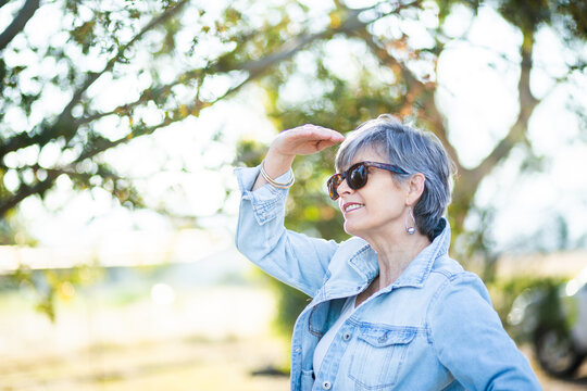 Senior woman looking away outside in natural setting