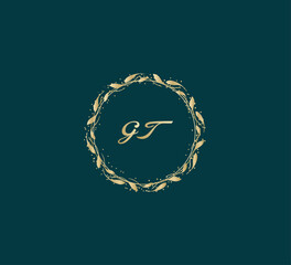 Handwritten golden GT getters logo with a minimalist design. letter GT logo manual elegant minimalist signature logotype. GT letter consist of intertwined elements into circle.