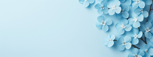 An abstract blue background, tender touch of blue forget-me-not petals, adorned in a dreamy palette, copy space, banner design