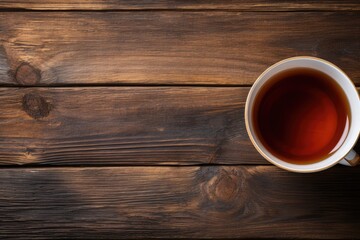 Hot Black Tea Served in a Cup on Wooden Background. A Healthy Beverage for Relaxation. Top View