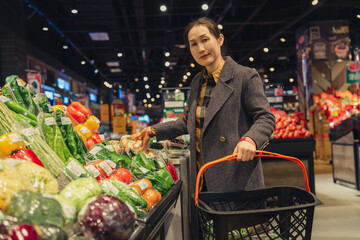 Confident Woman Choosing Fresh Vegetables in Store
