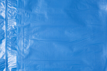 Blue plastic wrinkled bag texture and background