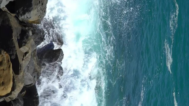 Huge waves break on the coastal cliffs of the Italian Riviera