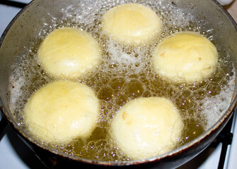 Delicious donuts are made by hand in the kitchen