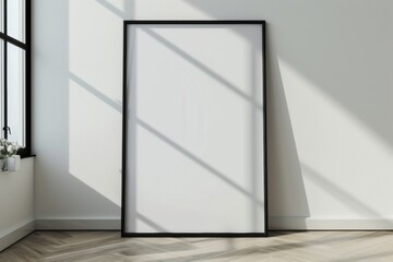 Display your art in style with this blank, vertical black poster frame, perfect for any picture or  exhibition. Hang it on a white wall to create a clean, modern gallery look.