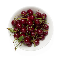 Ripe red cherries in bowl isolated on white, top view