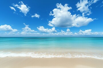 Fototapeta premium Escape to a tropical island paradise and relax on a serene beach with a breathtaking seascape, where the vast sea meets the endless horizon under a clear blue sky.