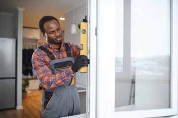 African service man installing window