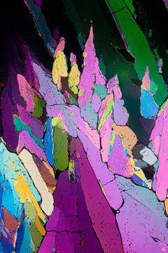 Abstract art-like image of erythritol sugar crystals under a microscope, with a collage of vivid, contrasting colors