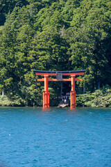A“red gate of peace” (heiwa no torii) in Hakone-jinja shrine standing proud and tall in Ashinoko Lake, Kanagawa prefecture, Japan 