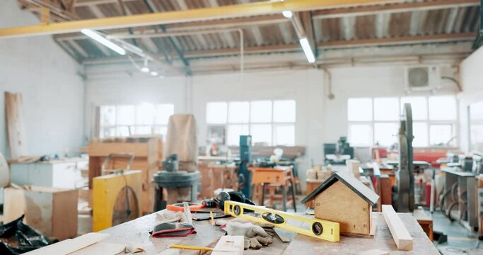 Carpentry, woodwork or empty factory with tools, equipment on table or manufacturing furniture. Wood, workshop or warehouse for storage, building or construction for production in industrial business