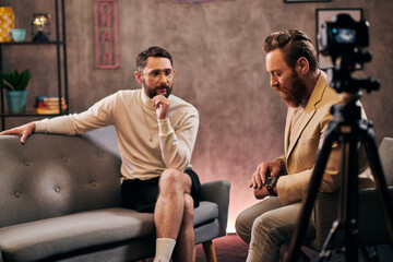 good looking bearded men in elegant stylish attires sitting and discussing interview questions