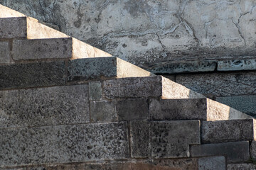 Abstract detail of stone steps going up an ancient temple.