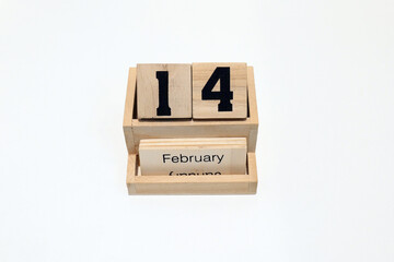 14th of February wooden perpetual calendar. Shot close up isolated on a white background