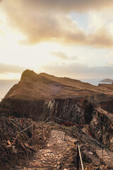 Rocky trail under moody skies.
