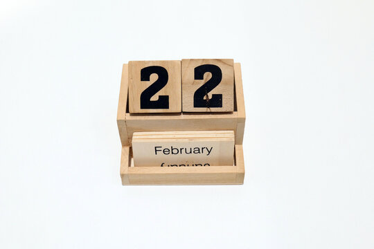 22nd of February wooden perpetual calendar. Shot close up isolated on a white background 