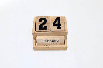 24th of February wooden perpetual calendar. Shot close up isolated on a white background 